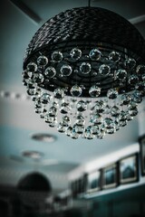 Luxurious and elegant chandelier hangs from the ceiling.
