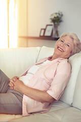 Portrait, smile and senior woman on a couch, relax and happiness at home, calm and peaceful. Face,...