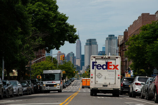 Fedex truck delivering on NYC streets, copy space background image