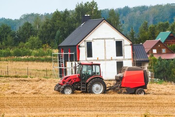 Fototapeta premium Agricultural Industry in Action. Wheat Harvesting on the Farmland. Combine Harvester at Work in the Golden Field.