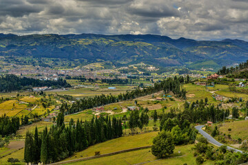 Fototapeta na wymiar Colombian town of Paipa in Boyaca region, travel destination, natural light background copy space image, mountain range small town