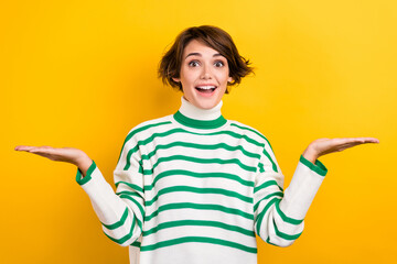 Portrait of excited worker girl hold open arms palms novelty select products wear striped pullover...