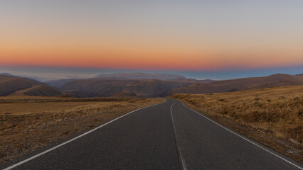 Scenic road in the mountains at sunset