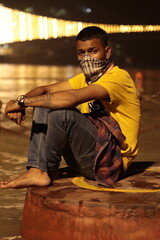 a man sitting on the Ganga ghat in haridwar Uttarakhand 