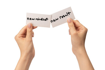 New mindset - new result  text on a card in a woman hand.