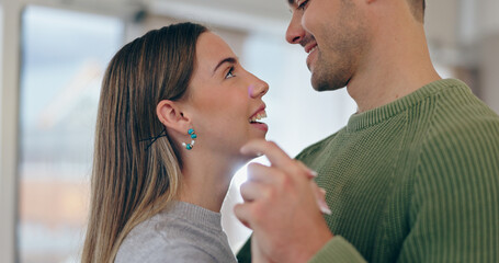 Love, dancing and young couple bonding at apartment on a romantic date listening to music or playlist. Happy, positive and man and woman from Canada moving to song in living room of modern home.