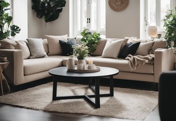 Black round coffee table near beige sofa with multicolored pillows Scandinavian style home interior