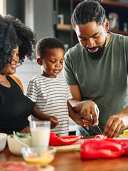 Foto op Plexiglas child family kitchen food boy son mother father meal preparing healthy diet eating home black african american father lunch dinner ingredient cooking chopping knife © Lumos sp