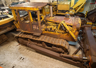 rusty bulldozer loader heavy machinery inside a ship