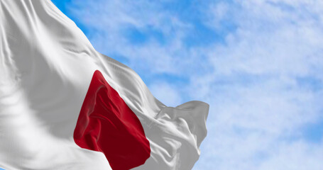 Japan national flag waving in the wind on a clear day - 675917140