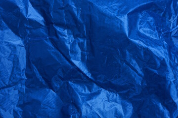 dark blue texture from a piece of old crumpled cellophane package