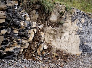 Rock and cut stone along a road under construction in a natural area - 675924131