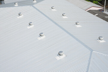 metal sheet roofing on commercial construction © Aphisith