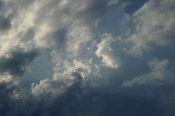 Naklejka na ściany i meble Skyscape. Cumulus clouds in close-up.