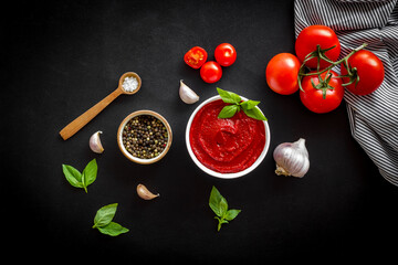 Italian tomato sauce for pasta - passata with tomatoes and basil