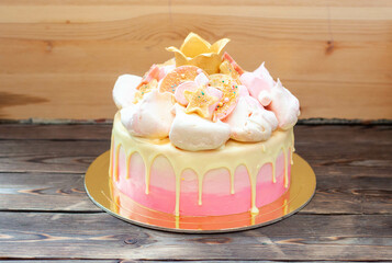 Gradient pink birthday cake with meringue clouds, chocolate stars, donuts and golden fondant crown...