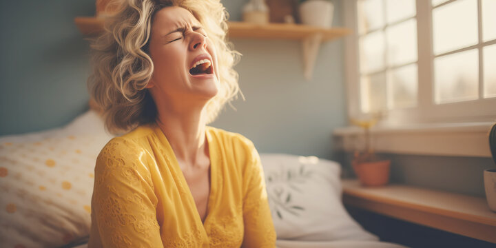 Woman with allergy or flu sneezing at home.