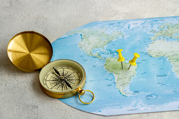Planning travel concept with world map and compass. Vacation trip concept