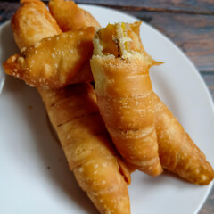 Pisang Molen is a variety of snacks made from bananas which are smeared with flour batter and then fried.