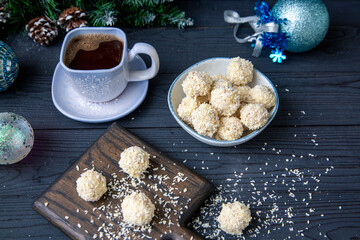 A cup of coffee and candy on Christmas Eve. Cozy house. Homemade sweets.
