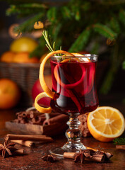 Christmas mulled wine with citrus, cinnamon, anise, and rosemary.