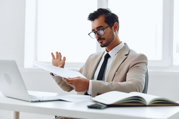 Fototapeta premium Paper office planning businessman holding laptop