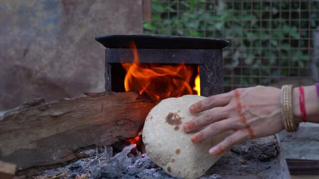 Making Roti Indian Chapati on Roti Tawa Made of Wheat Stock Image