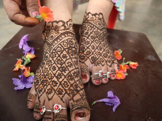 Indian religion and culture to put mehendi on foot, mehendi design, selective focus 