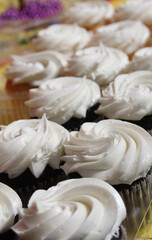Cupcakes With White Icing on Table at Party or Event