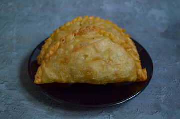 Kue pastel or Jalangkote, traditional snack from Indonesia filled with carrots, potatoes, macroni and boiled egg.