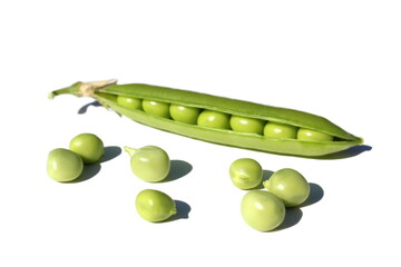 Green Peas pod and peas lie on a white isolated background.	