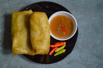 Lumpia traditional snacks from Semarang, Central Java, Indonesia. Traditional spring rolls contain vegetables.