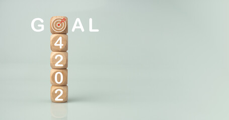 Wooden blocks lined up with the letters 2024. Represents the goal setting for 2023, the concept of...