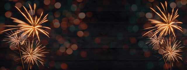 HAPPY NEW YEAR - Sylvester, New Year's Eve 2023 Party, New year, Firework celebration background banner panorama - Orange fireworks and bokeh lights on dark rustic wooden wall texture in the night. - obrazy, fototapety, plakaty