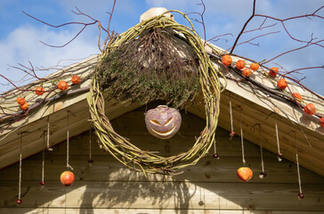 jack o lantern on a wooden building at halloween © paultate