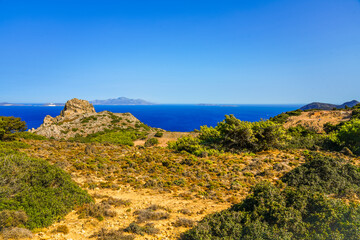 View of the landscape and the Mediterranean Sea from a mountain on the Greek island of Kos.	