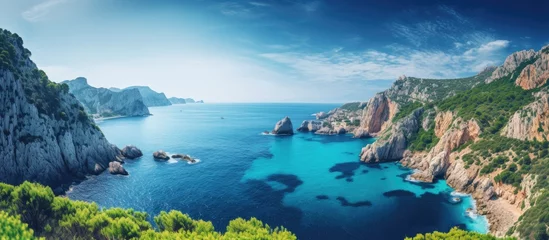 Fotobehang In the idyllic summers of Europe travelers venture to experience the breathtaking beauty of the azure sky and vibrant landscapes where the majestic cliffs along the Atlantic coastline meet t © TheWaterMeloonProjec