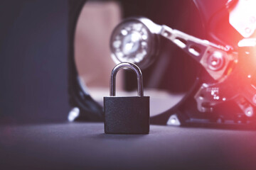 Saving user data. Hacking a password on a PC. Closing access to files. Hackers and secret data. HDD and key with lock.