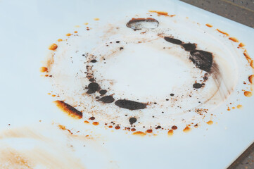 Dirty white electric stove after boiling hot food. Side view.