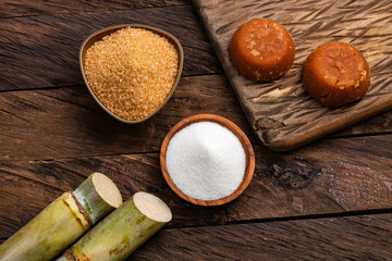 Saccharum officinarum - Panela, brown and white sugar with the stems of sugar cane