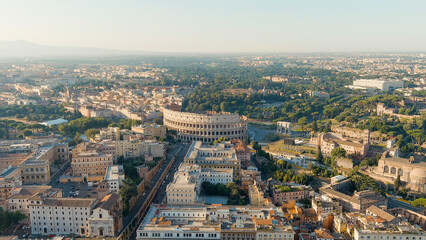 Rome, Italy. Roman Coliseum. Flight over the city. Panorama of the city in the morning. Summer,...