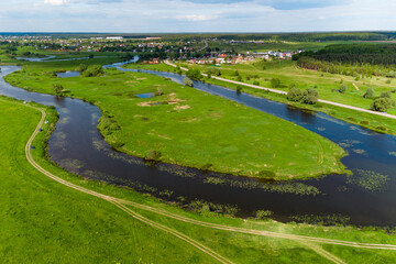 The bend of the oxbow lake Ogublyanka from the air, green natural landscape