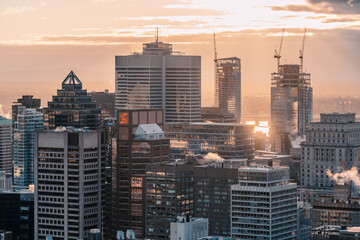Detail of Skyscrapers of Montreal at sunrise from Mont Royal, Business centre and skyscrapers warm light finance centers banks money