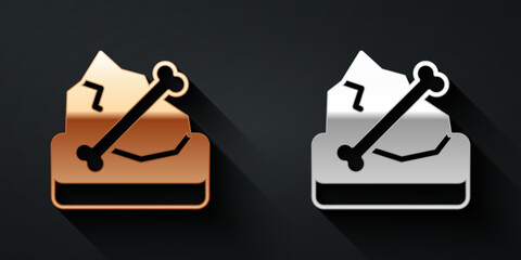 Gold and silver Archeology icon isolated on black background. Long shadow style. Vector