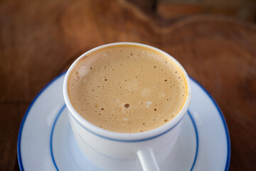 Close-Up and Focus on the Foam of a Freshly Brewed Coffee. With Copy Space
