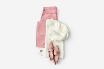 Fashion spring outfit. White  jumper with pale pink  jeans and loafers. Women's stylish and elegant...