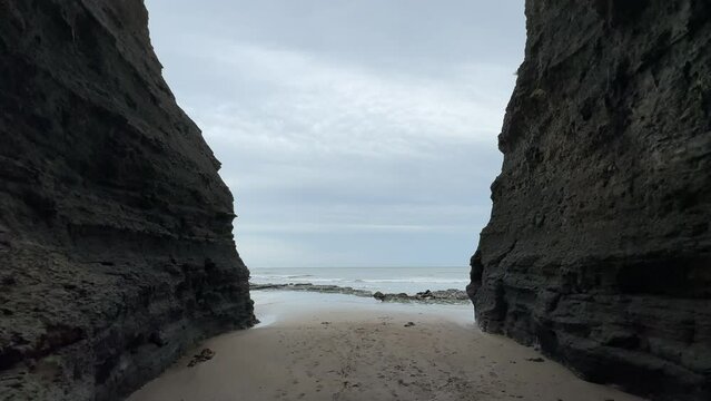 Looking out to sea from the famous tourist landmark known as 'Boggle Hole' cave. Situated in Fylingthorpe, near Whitby, North Yorkshire, England