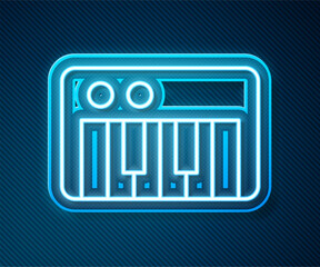 Glowing neon line Music synthesizer icon isolated on blue background. Electronic piano. Vector