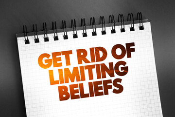Get Rid Of Limiting Beliefs text quote on notepad, concept background