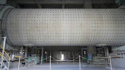 Ball mill in the cement industry. Industrial enterprise for cement processing. Territory of the...